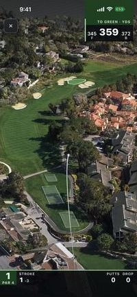 Moments after the swing: a thin white tracer climbs over a satellite view of the hole.
